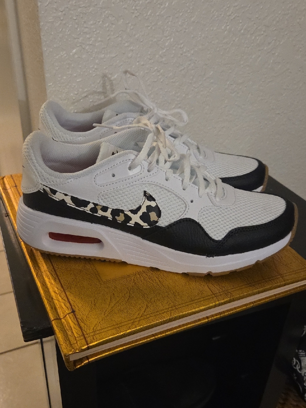 Nike Women’s White & Black Sneakers with Leopard Swoosh